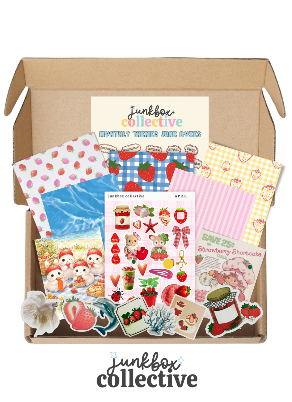 Junkbox Collective box with a various themed scraps and stickers on a white background